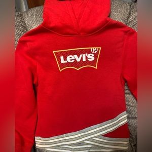 Levi’s Sweat shirt Red. Has stripped band around waistband. Has hood